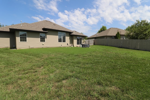 1224 S Mulberry Ave, Springfield, MO 65802 - rear view of house with a shingled roof
