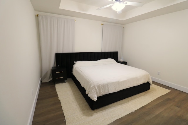 1224 S Mulberry Ave, Springfield, MO 65802 - bedroom featuring a raised ceiling, wood finished floors, and a ceiling fan