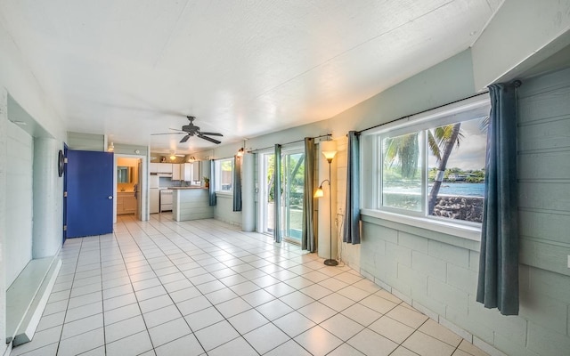 76-6280-C Alii Dr, Kailua-Kona, HI 96740 - unfurnished living room with a ceiling fan and light tile patterned flooring