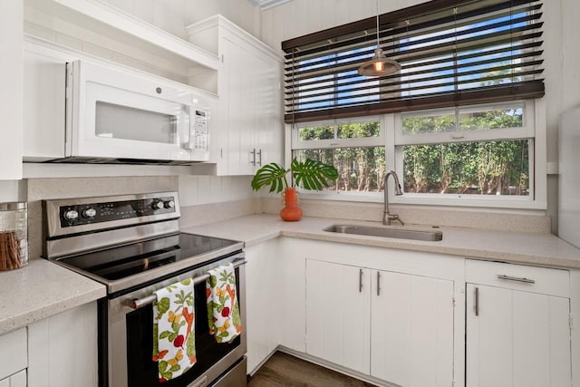 3821-B Ohuohu Rd, Koloa, HI 96756 - kitchen featuring electric range, a sink, white microwave, and plenty of natural light