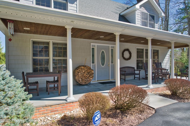 147 W Shore Rd, Shohola, PA 18458 - doorway to property with covered porch and roof with shingles