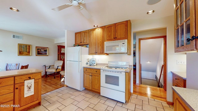 147 W Shore Rd, Shohola, PA 18458 - kitchen with white appliances, a ceiling fan, glass insert cabinets, brown cabinetry, and recessed lighting