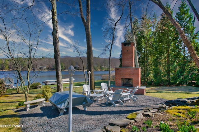 147 W Shore Rd, Shohola, PA 18458 - view of yard with an outdoor brick fireplace, a water view, and a patio