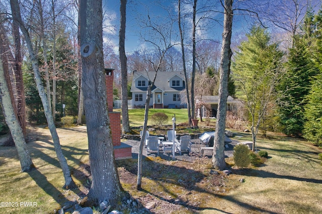 147 W Shore Rd, Shohola, PA 18458 - view of front of property featuring a chimney and a front yard