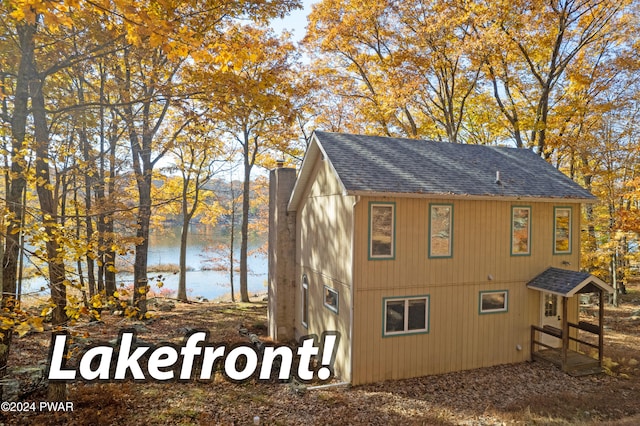 view of home's exterior with a water view