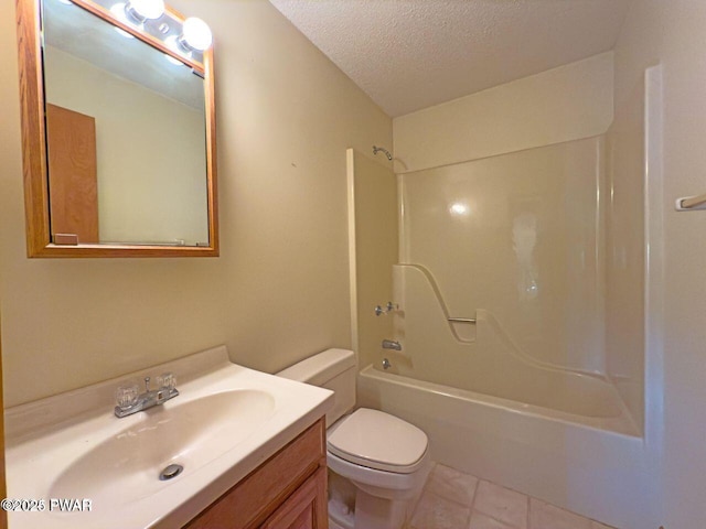 full bath with tile patterned floors, bathing tub / shower combination, toilet, vanity, and a textured ceiling