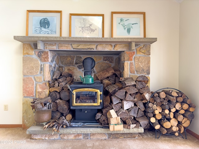 room details featuring a wood stove and carpet floors