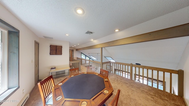 interior space featuring carpet flooring, vaulted ceiling with beams, a baseboard radiator, and a textured ceiling