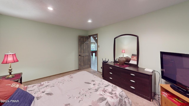 bedroom featuring light carpet