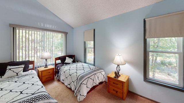 carpeted bedroom with lofted ceiling and a textured ceiling