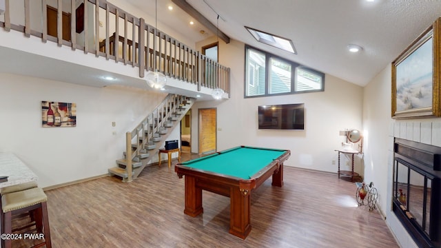 rec room with hardwood / wood-style floors, billiards, and high vaulted ceiling