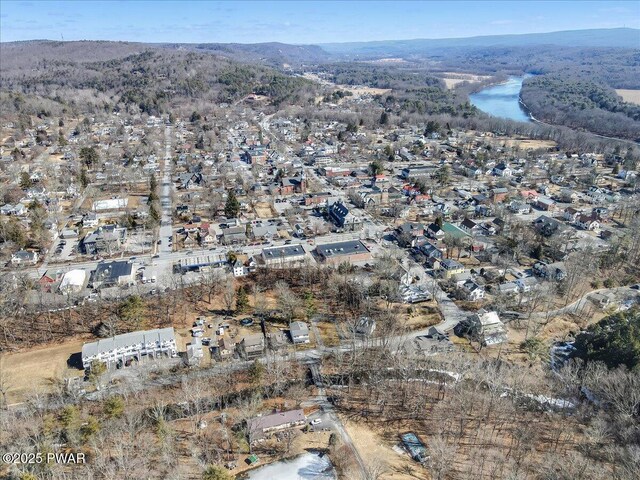 drone / aerial view featuring a mountain view