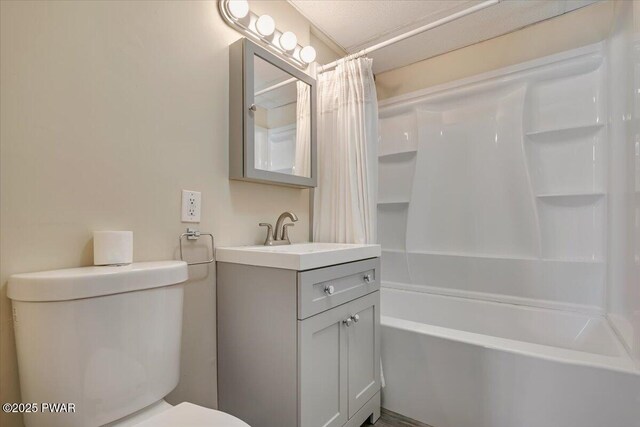 full bath with toilet, shower / bath combo, and vanity