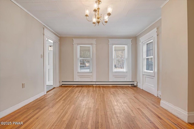 interior space featuring light wood-style flooring, a baseboard heating unit, crown molding, and an inviting chandelier