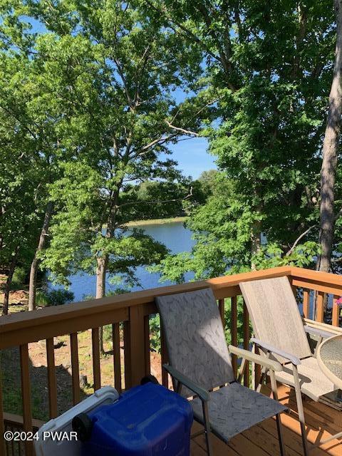 deck featuring a water view