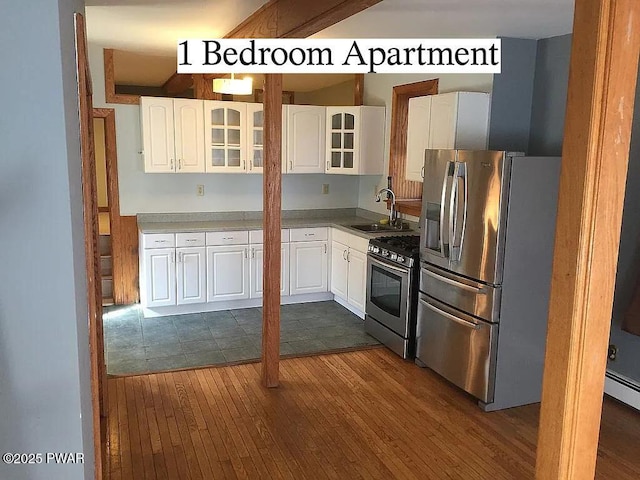 27 Maple Trail, Trail, NY 12790 - kitchen featuring stainless steel appliances, dark wood-type flooring, glass insert cabinets, and white cabinetry