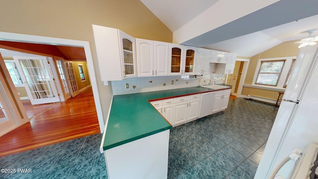 27 Maple Trail, Trail, NY 12790 - kitchen featuring lofted ceiling, white appliances, baseboard heating, glass insert cabinets, and white cabinets