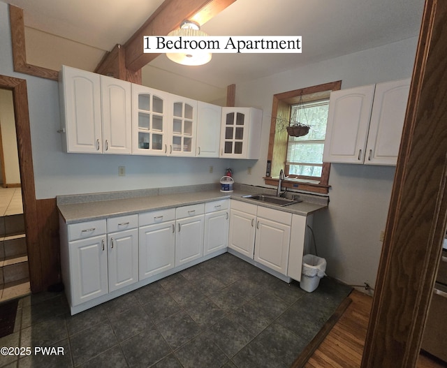 27 Maple Trail, Trail, NY 12790 - kitchen featuring glass insert cabinets, white cabinetry, and light countertops