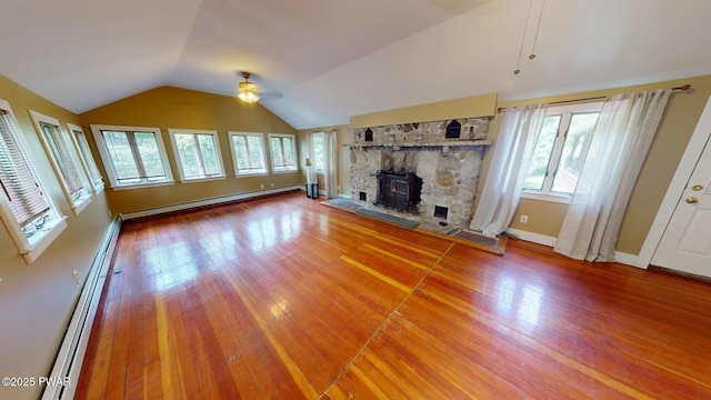 27 Maple Trail, Trail, NY 12790 - unfurnished living room featuring a baseboard heating unit, a ceiling fan, healthy amount of natural light, a baseboard radiator, and lofted ceiling
