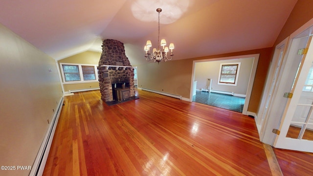 27 Maple Trail, Trail, NY 12790 - unfurnished living room with a baseboard heating unit, lofted ceiling, and wood finished floors