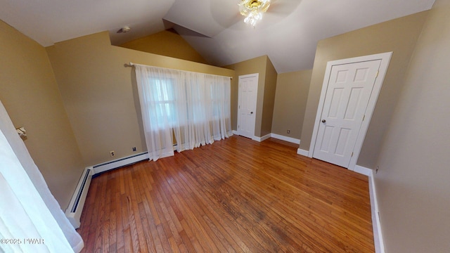 27 Maple Trail, Trail, NY 12790 - unfurnished bedroom with wood-type flooring, lofted ceiling, a baseboard radiator, and ceiling fan