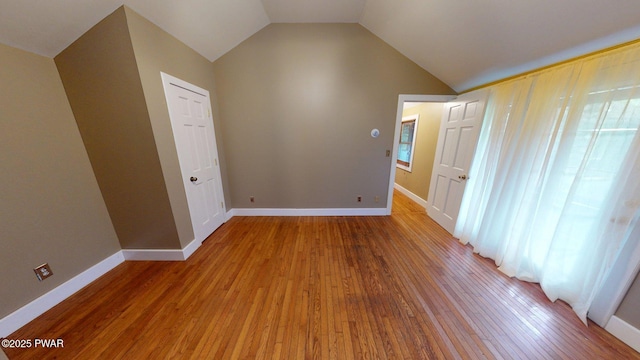 27 Maple Trail, Trail, NY 12790 - unfurnished bedroom with light wood-style flooring and vaulted ceiling