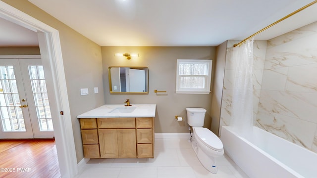 full bath with shower / tub combo, baseboards, french doors, toilet, and vanity