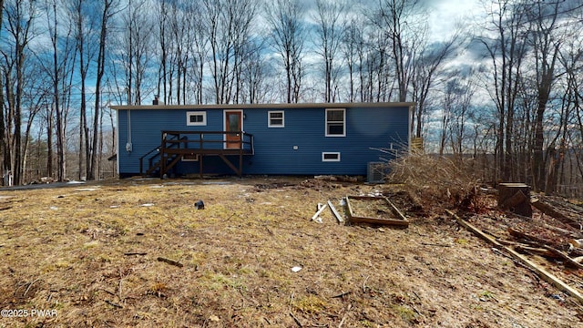 back of property featuring a wooden deck