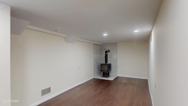 1 Mountain Crest Dr, Lake Ariel, PA 18436 - unfurnished living room with a wood stove, recessed lighting, visible vents, baseboards, and wood finished floors
