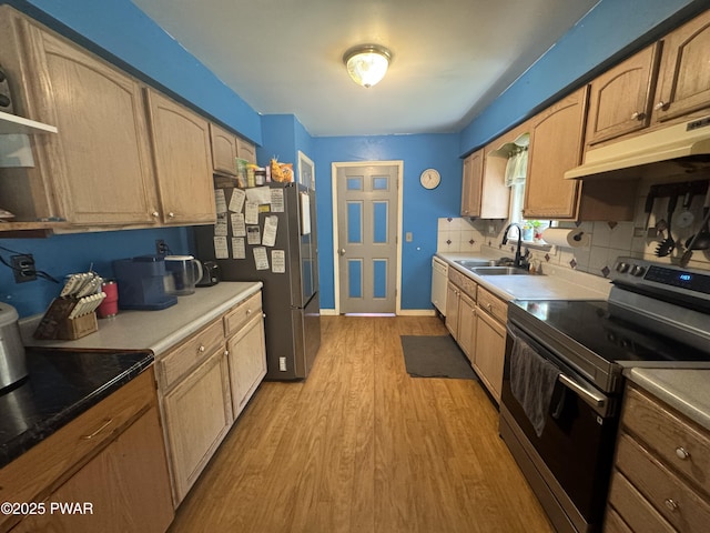 3205 Creamton Dr, Lake Como, PA 18437 - kitchen with stainless steel appliances, light wood-style flooring, under cabinet range hood, backsplash, and open shelves