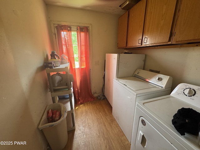 3205 Creamton Dr, Lake Como, PA 18437 - laundry room featuring washing machine and dryer, light wood-type flooring, and cabinet space