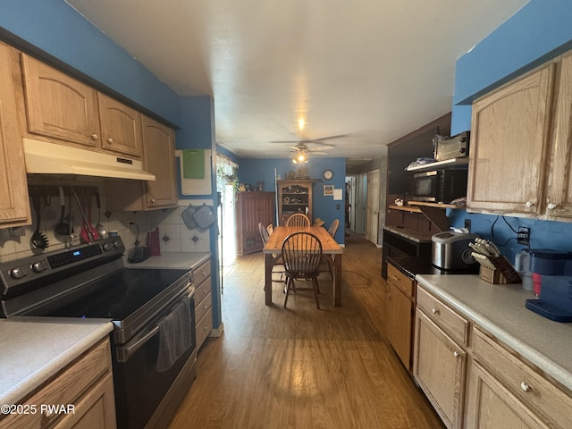 3205 Creamton Dr, Lake Como, PA 18437 - kitchen with range with electric cooktop, under cabinet range hood, dark wood finished floors, light countertops, and a ceiling fan