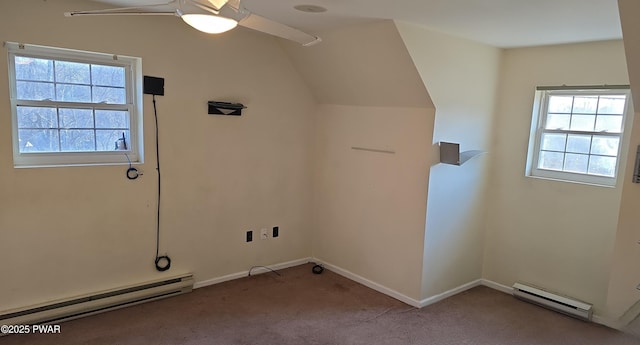 laundry room featuring a ceiling fan, baseboards, carpet floors, and a baseboard radiator