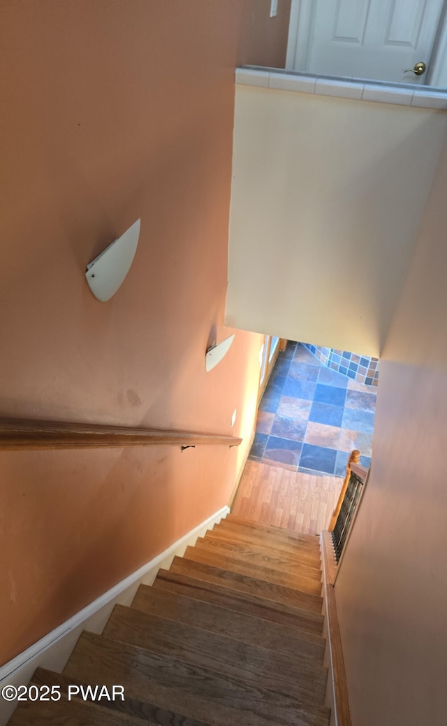 stairs featuring wood finished floors and visible vents