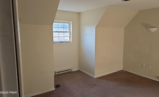 bonus room with a baseboard heating unit, carpet floors, and baseboards