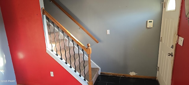 stairs with tile patterned flooring