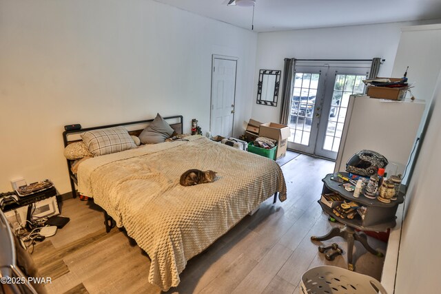 174 Laverne Dr, Dingmans Ferry, PA 18328 - bedroom featuring french doors, access to outside, and wood finished floors