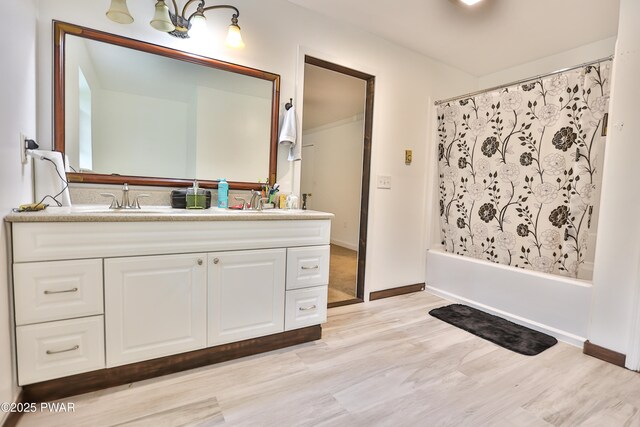 174 Laverne Dr, Dingmans Ferry, PA 18328 - full bath featuring vanity, wood finished floors, and shower / bath combo with shower curtain