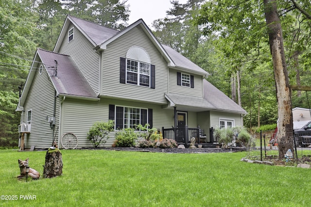 174 Laverne Dr, Dingmans Ferry, PA 18328 - view of front facade with a front lawn and roof with shingles