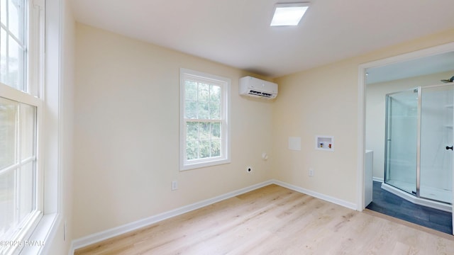 136 Heaters Hill Rd, Matamoras, PA 18336 - spare room featuring a wall unit AC and light wood-style floors