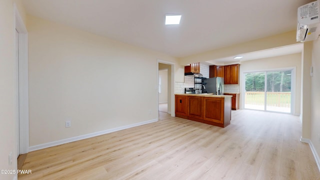 136 Heaters Hill Rd, Matamoras, PA 18336 - kitchen with light countertops, light wood-style flooring, brown cabinets, stainless steel fridge with ice dispenser, and decorative backsplash