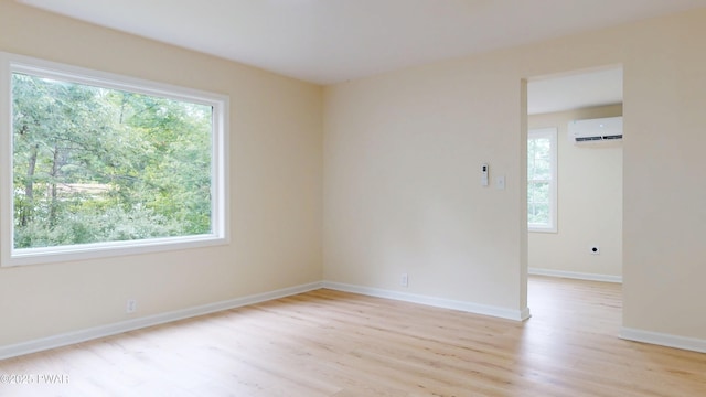 136 Heaters Hill Rd, Matamoras, PA 18336 - unfurnished room with a wall mounted AC and light wood-style floors