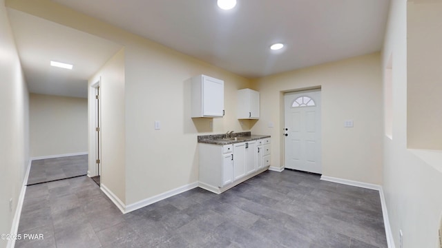 136 Heaters Hill Rd, Matamoras, PA 18336 - kitchen with white cabinets, dark countertops, and recessed lighting