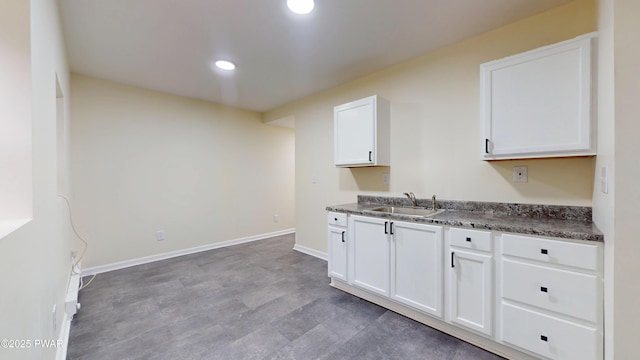 136 Heaters Hill Rd, Matamoras, PA 18336 - kitchen with white cabinetry, dark countertops, recessed lighting, and light wood-type flooring