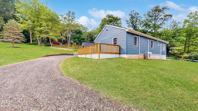 136 Heaters Hill Rd, Matamoras, PA 18336 - view of property exterior featuring driveway, a lawn, a deck, and view of wooded area