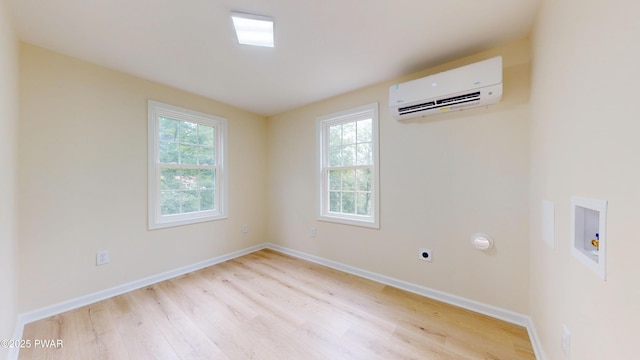 136 Heaters Hill Rd, Matamoras, PA 18336 - unfurnished room featuring a wall mounted air conditioner and light wood-type flooring