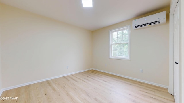 136 Heaters Hill Rd, Matamoras, PA 18336 - spare room with a wall mounted air conditioner and light wood finished floors