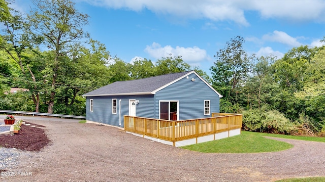 136 Heaters Hill Rd, Matamoras, PA 18336 - rear view of house with a deck, a shingled roof, driveway, and a lawn