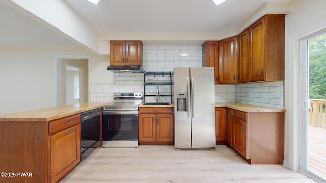 136 Heaters Hill Rd, Matamoras, PA 18336 - kitchen featuring stainless steel appliances, under cabinet range hood, decorative backsplash, and butcher block countertops