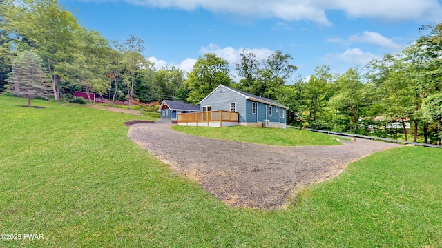 136 Heaters Hill Rd, Matamoras, PA 18336 - view of side of property with gravel driveway, a lawn, and an outdoor structure